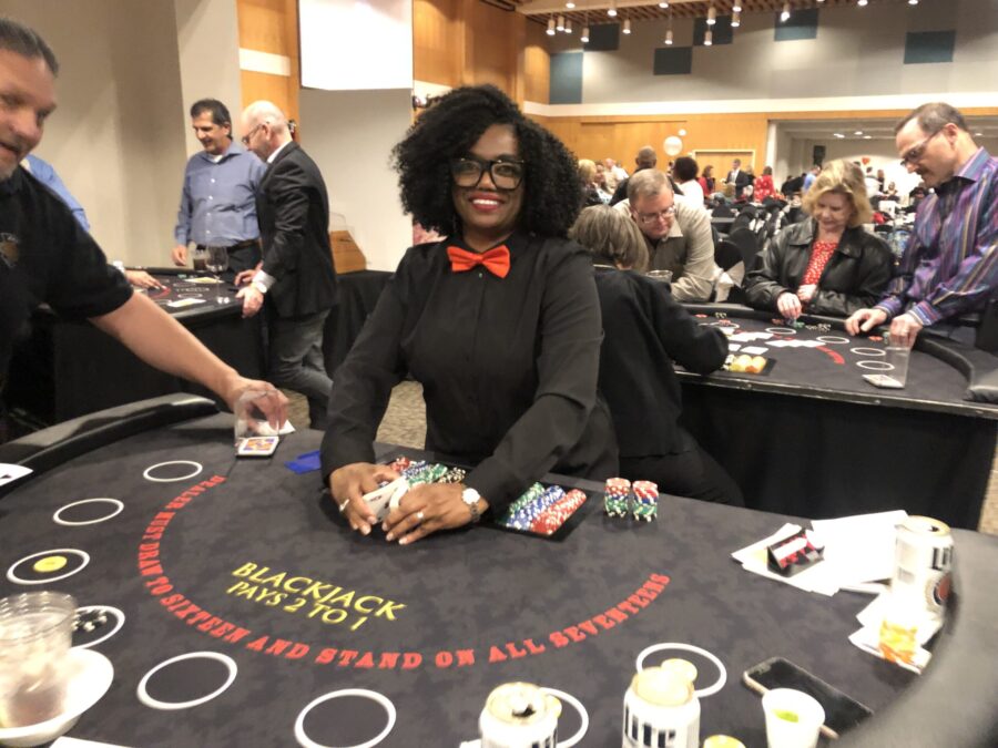 Very Happy blackjack dealer at Black Tie Casino Party Rental tables