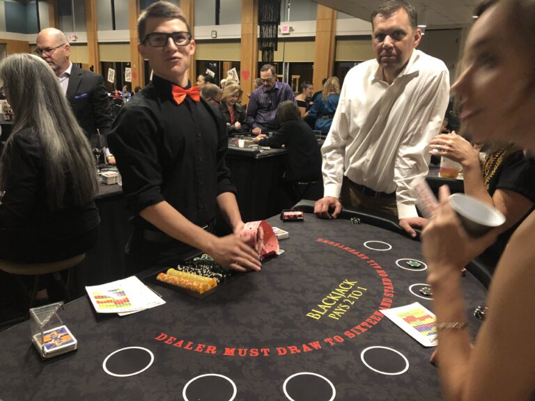 Dealing blackjack at Black Tie Casino Party Rental tables