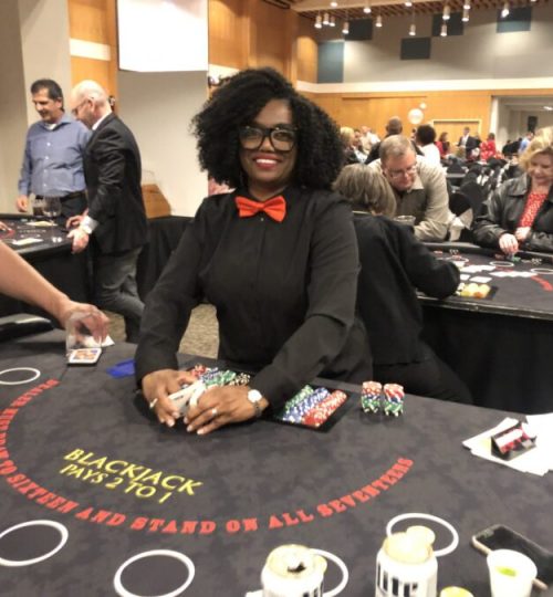 Very Happy blackjack dealer at Black Tie Casino Party Rental tables