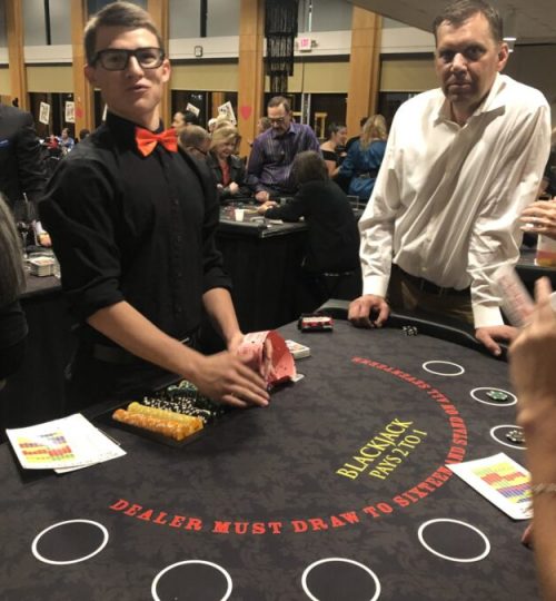 Dealing blackjack at Black Tie Casino Party Rental tables